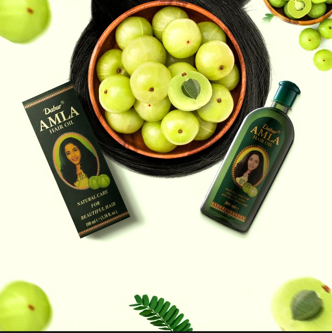 Fresh Indian gooseberries (Amla) rich in Vitamin C used in Dabur Amla Hair Oil for nourishing and strengthening hair.